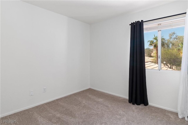 2219 Rugged Mesa Dr, Laughlin, NV 89029 - spare room with light colored carpet and baseboards