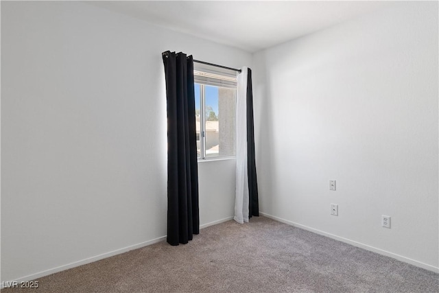2219 Rugged Mesa Dr, Laughlin, NV 89029 - spare room with light carpet and baseboards