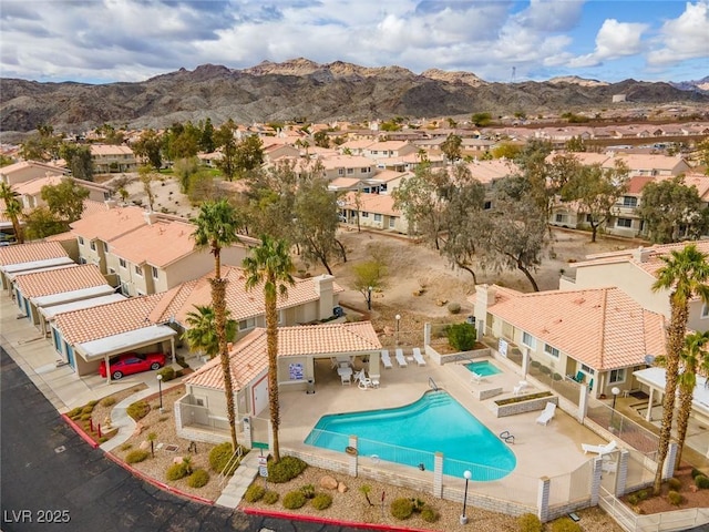 2219 Rugged Mesa Dr, Laughlin, NV 89029 - community pool featuring a residential view, a fenced backyard, a mountain view, and a community hot tub