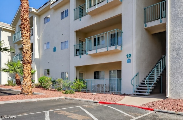 3550 Bay Sands Dr Unit 1093, Laughlin, NV 89029 - view of apartment building / complex with uncovered parking and stairway
