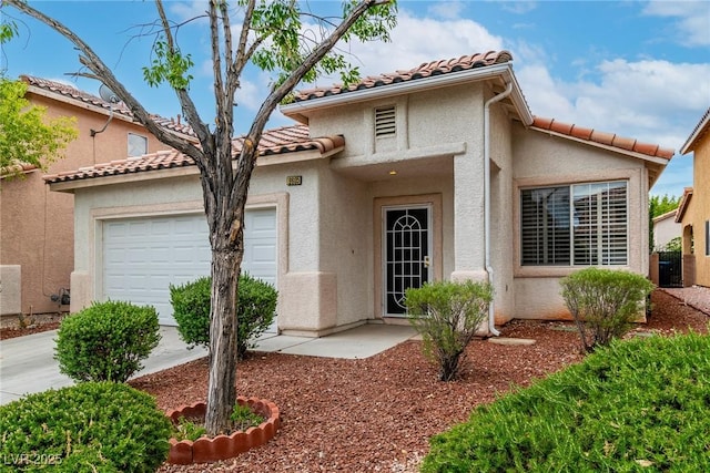 9605 Rainfall Ave, Las Vegas, NV 89147 - view of front of house with a garage, a tiled roof, and stucco siding