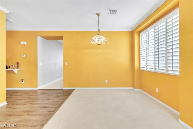 9605 Rainfall Ave, Las Vegas, NV 89147 - spare room featuring ornamental molding, a chandelier, and wood finished floors