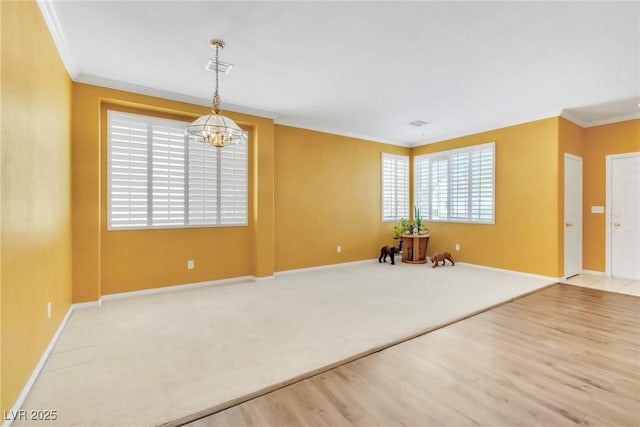 9605 Rainfall Ave, Las Vegas, NV 89147 - foyer entrance featuring crown molding, healthy amount of natural light, a chandelier, wood finished floors, and carpet