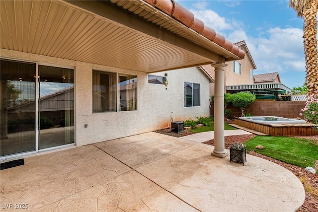 9605 Rainfall Ave, Las Vegas, NV 89147 - fenced backyard with a hot tub and a patio area