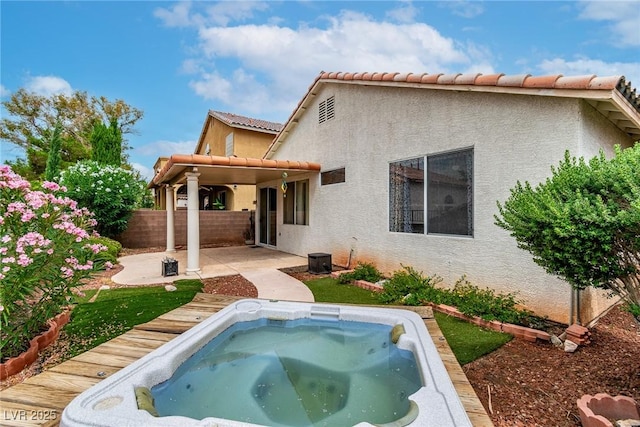 9605 Rainfall Ave, Las Vegas, NV 89147 - back of property with stucco siding, a patio area, an outdoor hot tub, and a tile roof