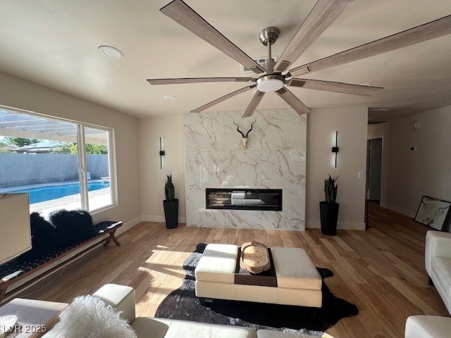 2712 Rialto Rd, Las Vegas, NV 89108 - living room with a fireplace, ceiling fan, wood finished floors, and recessed lighting
