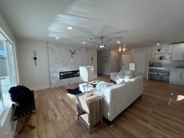 2712 Rialto Rd, Las Vegas, NV 89108 - living area featuring ceiling fan, recessed lighting, wood finished floors, and a fireplace