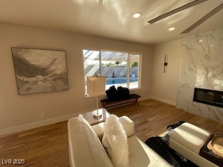 2712 Rialto Rd, Las Vegas, NV 89108 - living room with wood finished floors, recessed lighting, and a high end fireplace