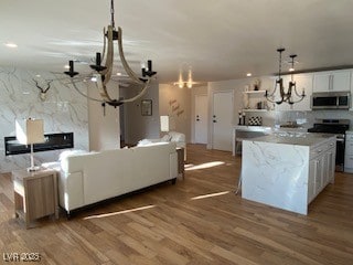 2712 Rialto Rd, Las Vegas, NV 89108 - living area with a chandelier and wood finished floors