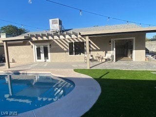 2712 Rialto Rd, Las Vegas, NV 89108 - back of house with an outdoor pool, a patio, stucco siding, and a pergola