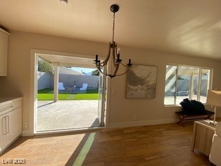 2712 Rialto Rd, Las Vegas, NV 89108 - unfurnished dining area with a chandelier and dark wood finished floors
