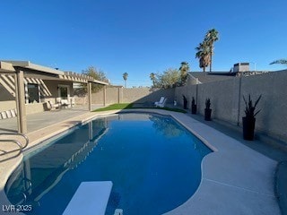 2712 Rialto Rd, Las Vegas, NV 89108 - view of swimming pool featuring a patio area, a fenced backyard, and a diving board