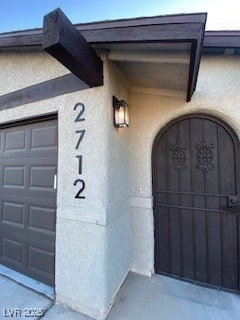 2712 Rialto Rd, Las Vegas, NV 89108 - doorway to property featuring stucco siding