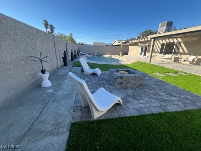 2712 Rialto Rd, Las Vegas, NV 89108 - fenced backyard featuring a patio area and an outdoor fire pit