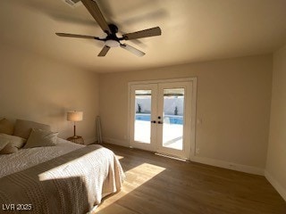 2712 Rialto Rd, Las Vegas, NV 89108 - bedroom with access to exterior, french doors, wood finished floors, and ceiling fan
