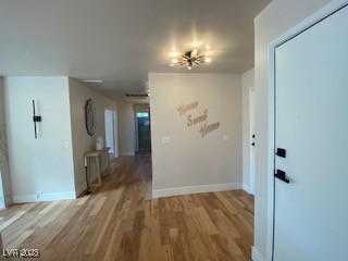 2712 Rialto Rd, Las Vegas, NV 89108 - hall with wood finished floors and baseboards