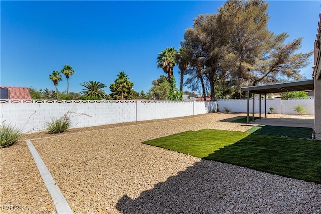 3826 Edmund St, Las Vegas, NV 89103 - fenced backyard with a patio area
