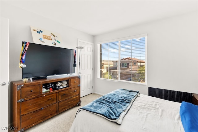10940 Oregano Ave, Las Vegas, NV 89166 - bedroom featuring light carpet and baseboards