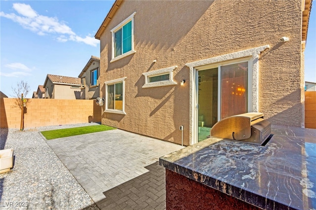 10940 Oregano Ave, Las Vegas, NV 89166 - fenced backyard with a patio