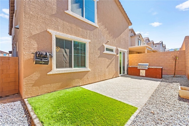 10940 Oregano Ave, Las Vegas, NV 89166 - view of yard with a patio and an outdoor kitchen