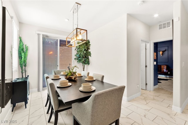 10940 Oregano Ave, Las Vegas, NV 89166 - dining space with light marble finish flooring, a chandelier, and recessed lighting