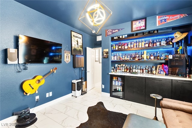 10940 Oregano Ave, Las Vegas, NV 89166 - indoor dry bar featuring marble finish floors and beverage cooler