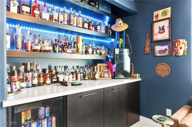 10940 Oregano Ave, Las Vegas, NV 89166 - indoor dry bar featuring beverage cooler and tile patterned flooring
