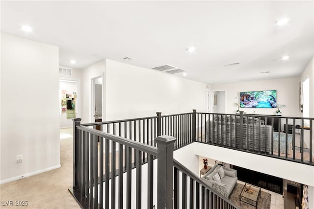 10940 Oregano Ave, Las Vegas, NV 89166 - corridor with an upstairs landing, light carpet, and recessed lighting