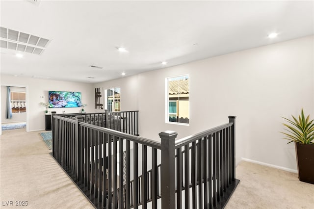 10940 Oregano Ave, Las Vegas, NV 89166 - hallway featuring an upstairs landing, light colored carpet, and recessed lighting