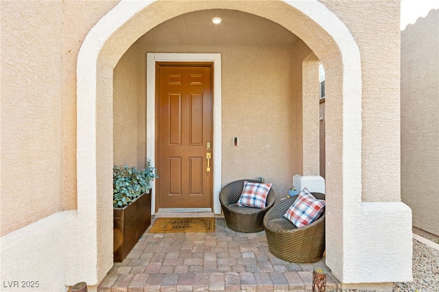 10940 Oregano Ave, Las Vegas, NV 89166 - doorway to property with stucco siding