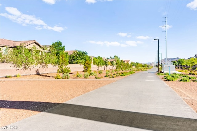 10940 Oregano Ave, Las Vegas, NV 89166 - view of asphalt road with street lights