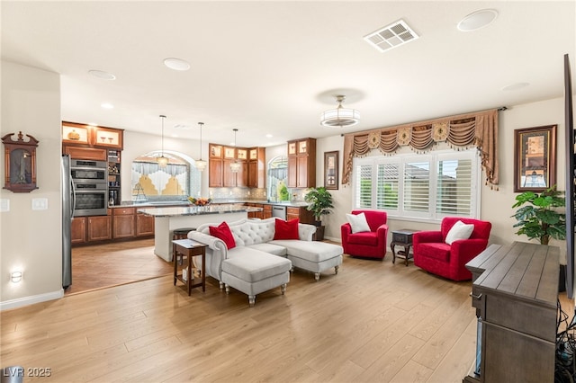 6595 Creekside Cellars Ct, Las Vegas, NV 89139 - living room featuring healthy amount of natural light, light wood-style floors, and recessed lighting