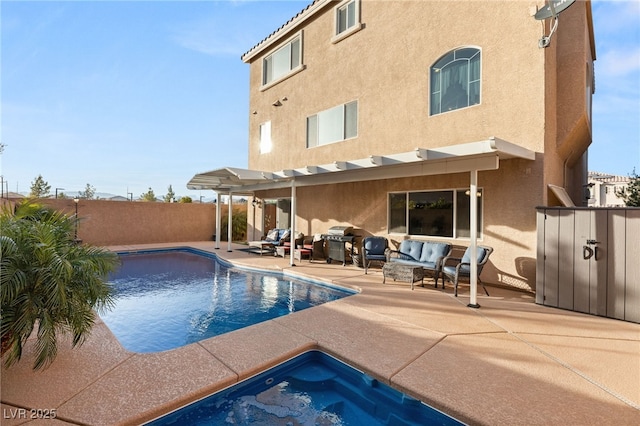 6595 Creekside Cellars Ct, Las Vegas, NV 89139 - rear view of house with stucco siding, an outdoor living space, a patio, a hot tub, and a fenced backyard