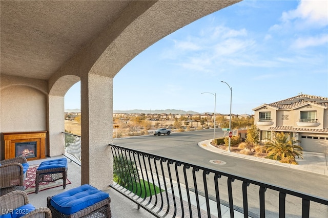 6595 Creekside Cellars Ct, Las Vegas, NV 89139 - balcony featuring a residential view and a glass covered fireplace