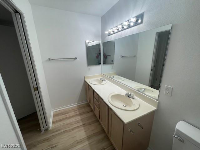 5130 Mandalay Springs Dr Unit 103, Las Vegas, NV 89120 - bathroom with wood finished floors and double vanity