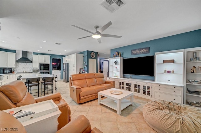 11417 Rock Cove Way, Las Vegas, NV 89141 - living room with ceiling fan, light tile patterned floors, arched walkways, and recessed lighting