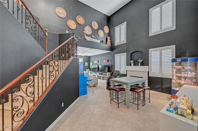 11417 Rock Cove Way, Las Vegas, NV 89141 - tiled dining room with stairs and a high ceiling