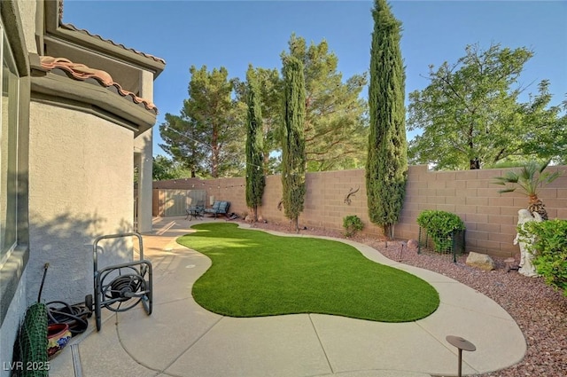 11417 Rock Cove Way, Las Vegas, NV 89141 - fenced backyard with a patio area