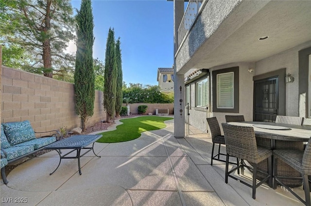 11417 Rock Cove Way, Las Vegas, NV 89141 - fenced backyard featuring a patio and outdoor dining space