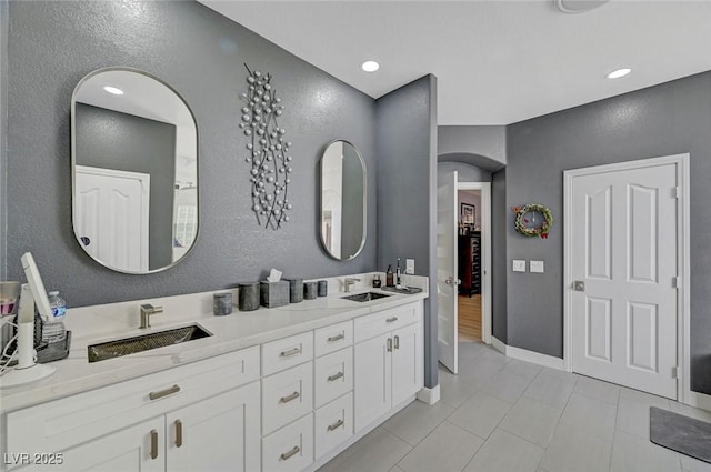 11417 Rock Cove Way, Las Vegas, NV 89141 - full bath featuring double vanity, tile patterned floors, a textured wall, and recessed lighting