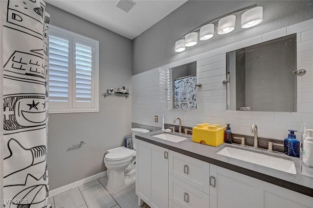 11417 Rock Cove Way, Las Vegas, NV 89141 - full bathroom with tasteful backsplash, double vanity, and curtained shower