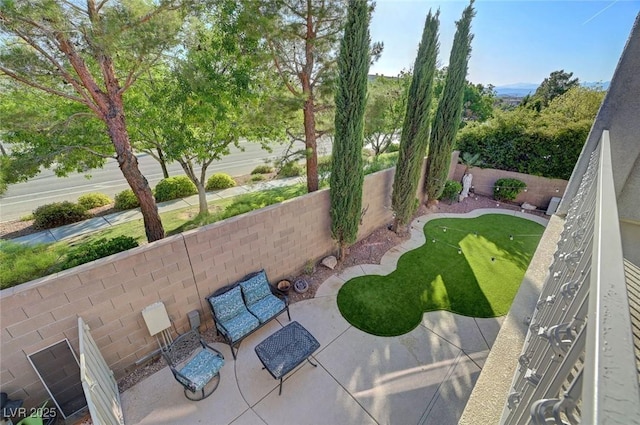 11417 Rock Cove Way, Las Vegas, NV 89141 - fenced backyard with a putting area and a patio area