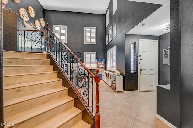 11417 Rock Cove Way, Las Vegas, NV 89141 - tiled entrance foyer with stairway and a textured wall