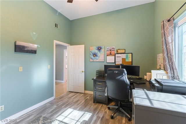 5600 Segolilly Cir, Las Vegas, NV 89130 - office area featuring wood finished floors, a ceiling fan, and a high ceiling