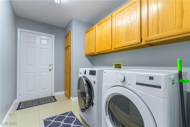 5600 Segolilly Cir, Las Vegas, NV 89130 - laundry room featuring cabinet space, washing machine and dryer, and light tile patterned flooring