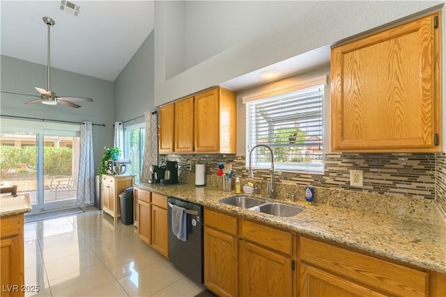 5600 Segolilly Cir, Las Vegas, NV 89130 - kitchen featuring dishwashing machine, high vaulted ceiling, ceiling fan, tasteful backsplash, and light tile patterned floors