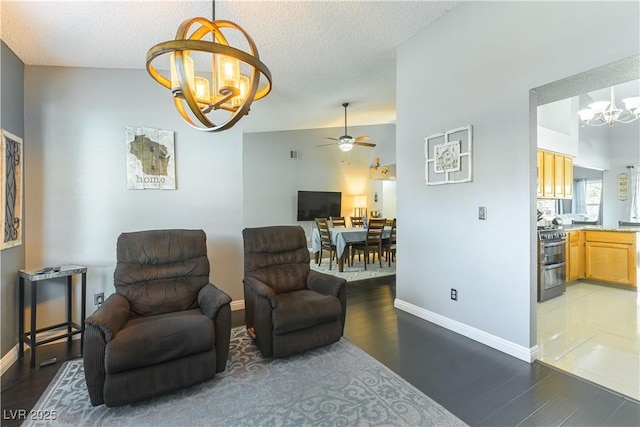 5600 Segolilly Cir, Las Vegas, NV 89130 - living area featuring a chandelier, a ceiling fan, wood finished floors, and a textured ceiling
