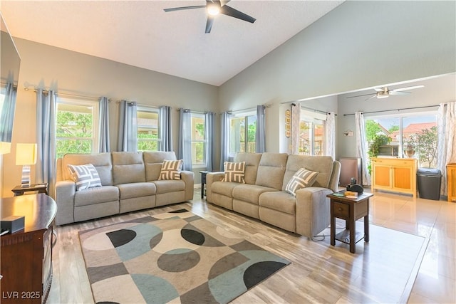 5600 Segolilly Cir, Las Vegas, NV 89130 - living room featuring a ceiling fan, healthy amount of natural light, high vaulted ceiling, and light wood finished floors
