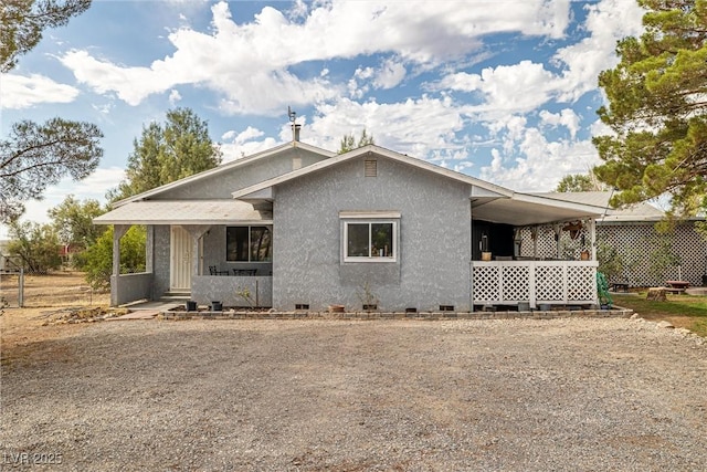 3951 W Blosser Ranch Rd, Pahrump, NV 89060 - view of front of property with crawl space, stucco siding, and a porch