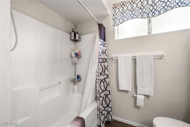 3951 W Blosser Ranch Rd, Pahrump, NV 89060 - bathroom with shower / tub combo with curtain and wood finished floors